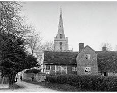 Lapworth Almshouses-1 Chatgpt The old 'almshouses' close to Lapworth Church from a photo from around 1890. They were demolished in 1892. Restored with AI